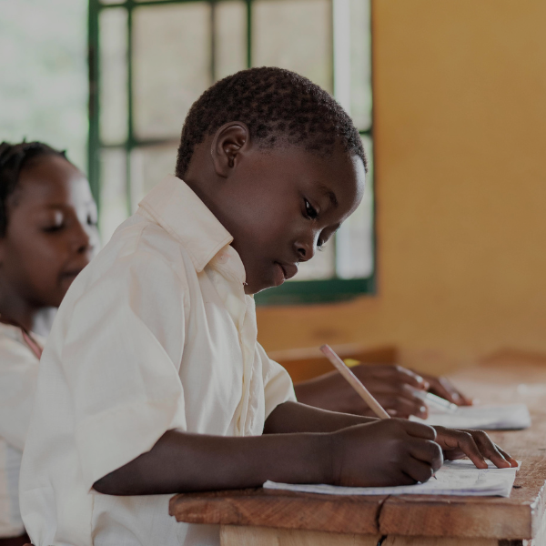 Vickies Foundation - Image of a boy writing